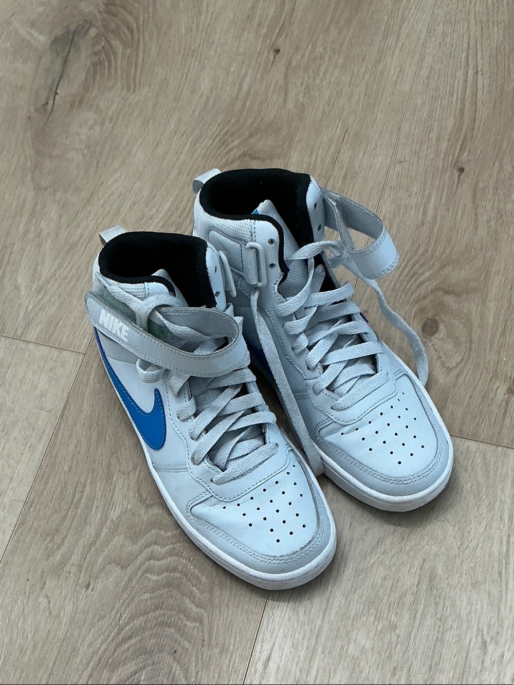 Nike White High-Top Sneakers with Blue Swoosh